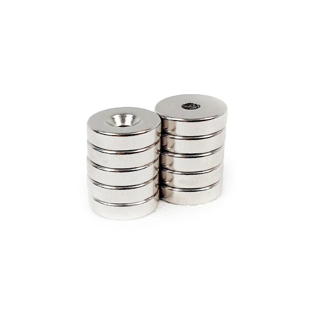 Round Circular Disc Neodymium magnet with countersunk hole for screwing and with dimensions 14mm x 3.6mm (3.5mm Hole), grade N42 , featuring a nickel-copper-nickel coating and an 3.52KG pull force, commonly used in DIY, crafts, furniture design, fixings, kitchen design, lock mechanisms and science experiments.