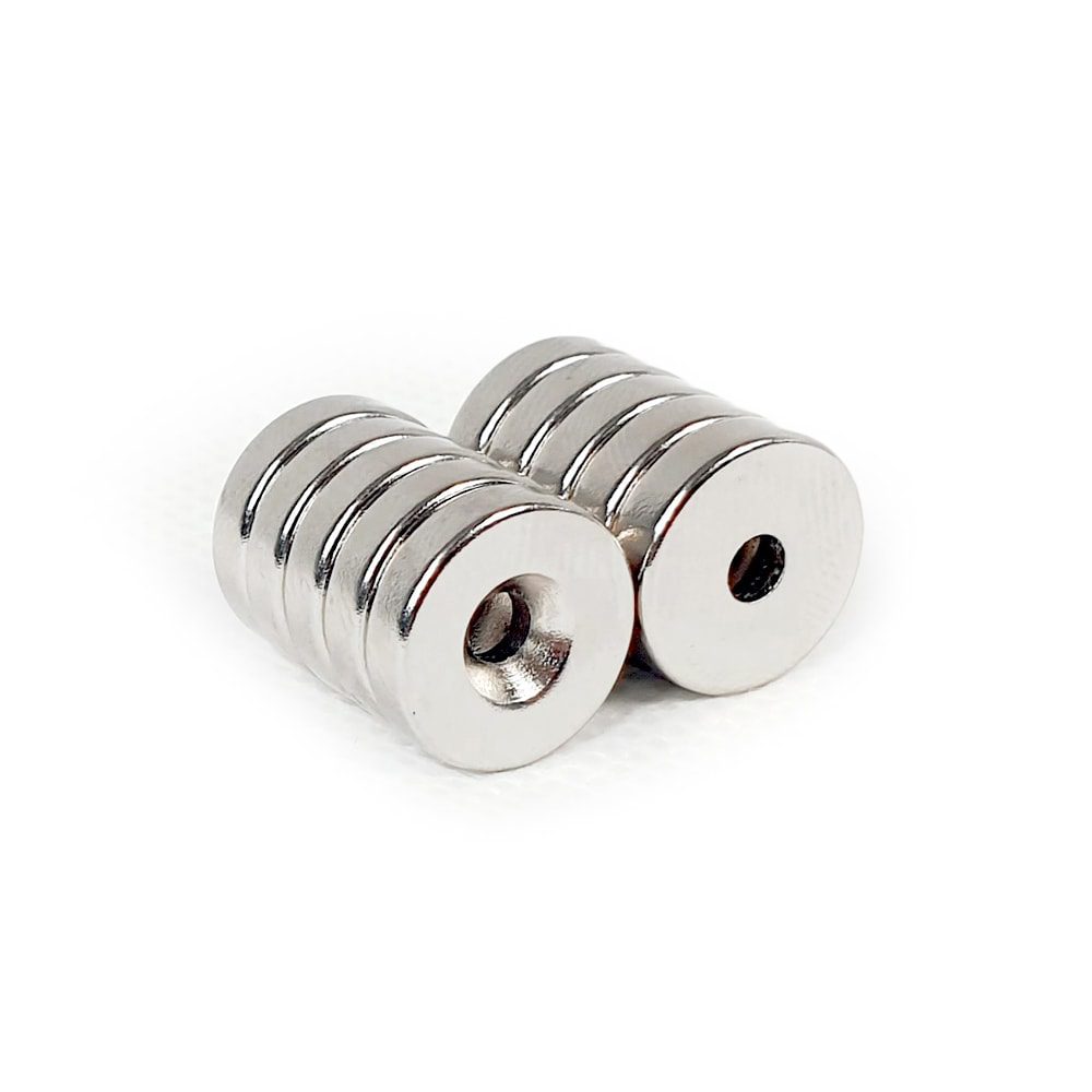 Round Circular Disc Neodymium magnet with countersunk hole for screwing and with dimensions 14mm x 3.6mm (3.5mm Hole), grade N42 , featuring a nickel-copper-nickel coating and an 3.52KG pull force, commonly used in DIY, crafts, furniture design, fixings, kitchen design, lock mechanisms and science experiments.