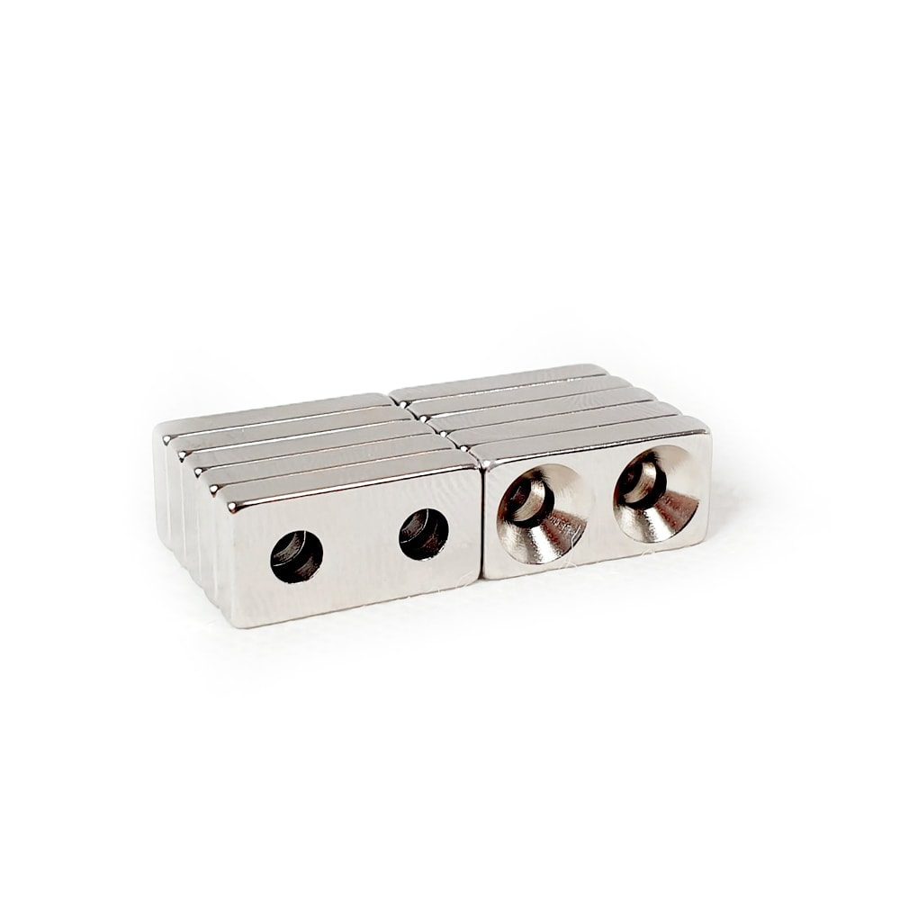 Rectangular Block Neodymium magnet with double countersunk hole for screwing and with dimensions 20mm x 10mm x 4mm (4mm Double Hole), grade N42, featuring a nickel-copper-nickel coating and an 2.81KG pull force, commonly used in DIY, crafts, furniture design, fixings, kitchen design, lock mechanisms and science experiments.