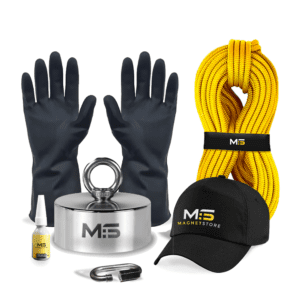 Magnet Fishing Kit for removing objects from bodies of water. Image shows the kit contents which includes Genesis 65 - 360 Degree fishing magnet with a pull force of 650KG , yellow rope, protective gloves, branded cap, threadlock, carabiner.