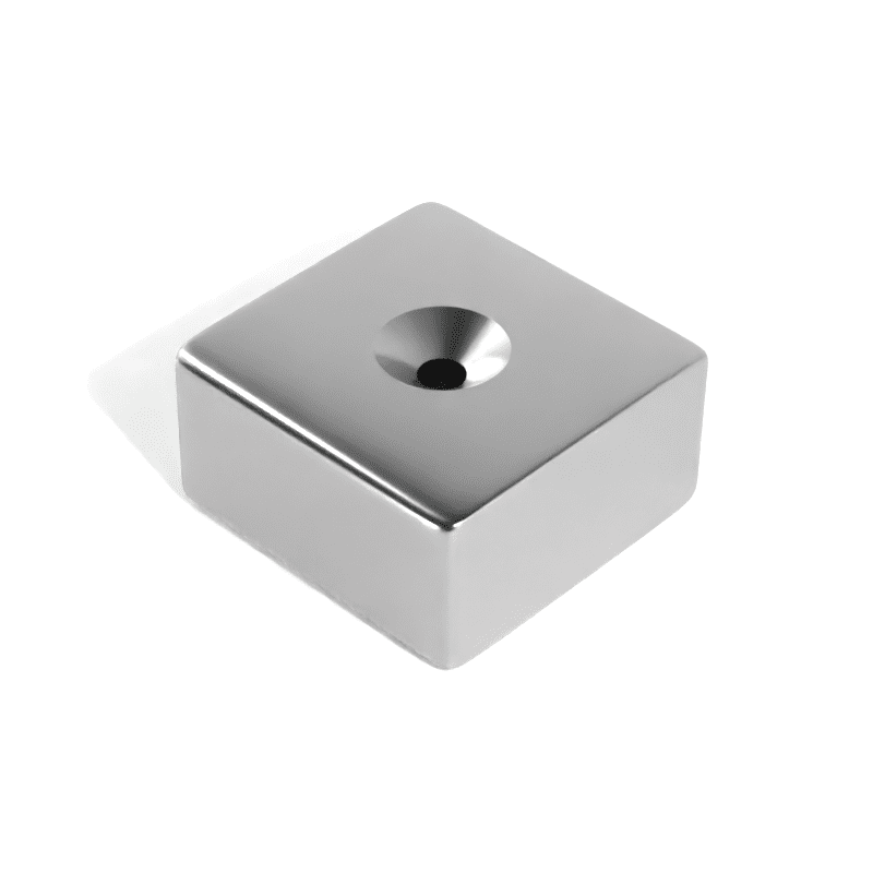 Square Block Neodymium magnet with countersunk hole for screwing and with dimensions 50mm x 50mm x 25mm x (8mm Hole), grade N52, featuring a nickel-copper-nickel coating and an 138.25KG pull force, commonly used in DIY, crafts, furniture design, fixings, kitchen design, lock mechanisms and science experiments.