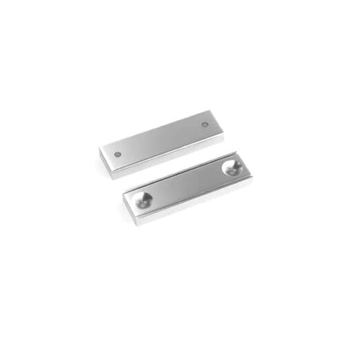Rectangular block channel magnets with countersunk hole for screwing and with dimensions 40mm x 13.5mm x 5mm (Two 3.3mm c/s holes), grade N35 , featuring a nickel-copper-nickel coating and an 17KG pull force, commonly used for securing into a flat service and used as magnetic door latches or holding display items and signs into place.