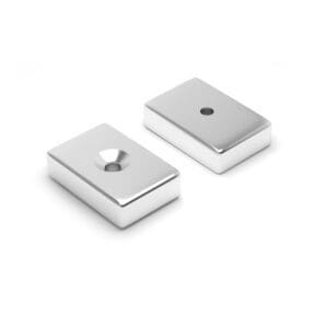 Rectangular Block Neodymium magnet with countersunk hole for screwing and with dimensions 15mm x 10mm x 4mm x (4mm Hole), grade N42, featuring a nickel-copper-nickel coating and an 3.99KG pull force, commonly used in DIY, crafts, furniture design, fixings, kitchen design, lock mechanisms and science experiments.