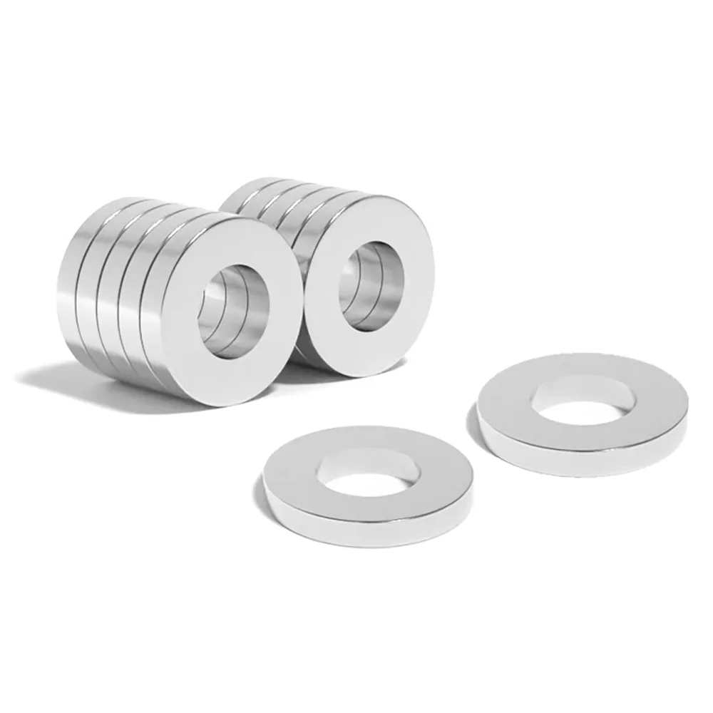 Round Circular Disc Neodymium magnet with ring hole with dimensions OD30mm x ID15mm x T5mm, grade N52 , featuring a nickel-copper-nickel coating and an 13.5KG pull force. With their strong magnetic force and sleek circular design, these versatile ring-shaped magnets can be easily incorporated into various applications, such as DIY, speaker assemblies, electric motors, science experiments, manufacturing processes and much more.