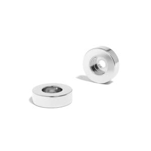 Round Circular Disc Neodymium magnet with counterbore hole for screwing and with dimensions 32mm x 10mm x (6.6mm Counterbore Hole), grade N52 , featuring a nickel-copper-nickel coating and an 27.7KG pull force. They are a staple in various applications including DIY, crafts, cabinetry, furniture assembly, and scientific experiments.