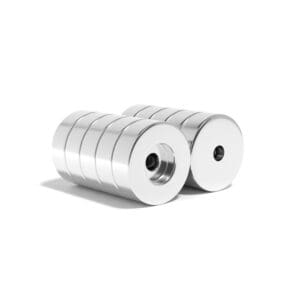 Round Circular Disc Neodymium magnet with counterbore hole for screwing and with dimensions 30mm x 10mm x (5.5mm Counterbore Hole), grade N52 , featuring a nickel-copper-nickel coating and an 26KG pull force. They are a staple in various applications including wood working, DIY, crafts, cabinetry, furniture assembly, and scientific experiments.
